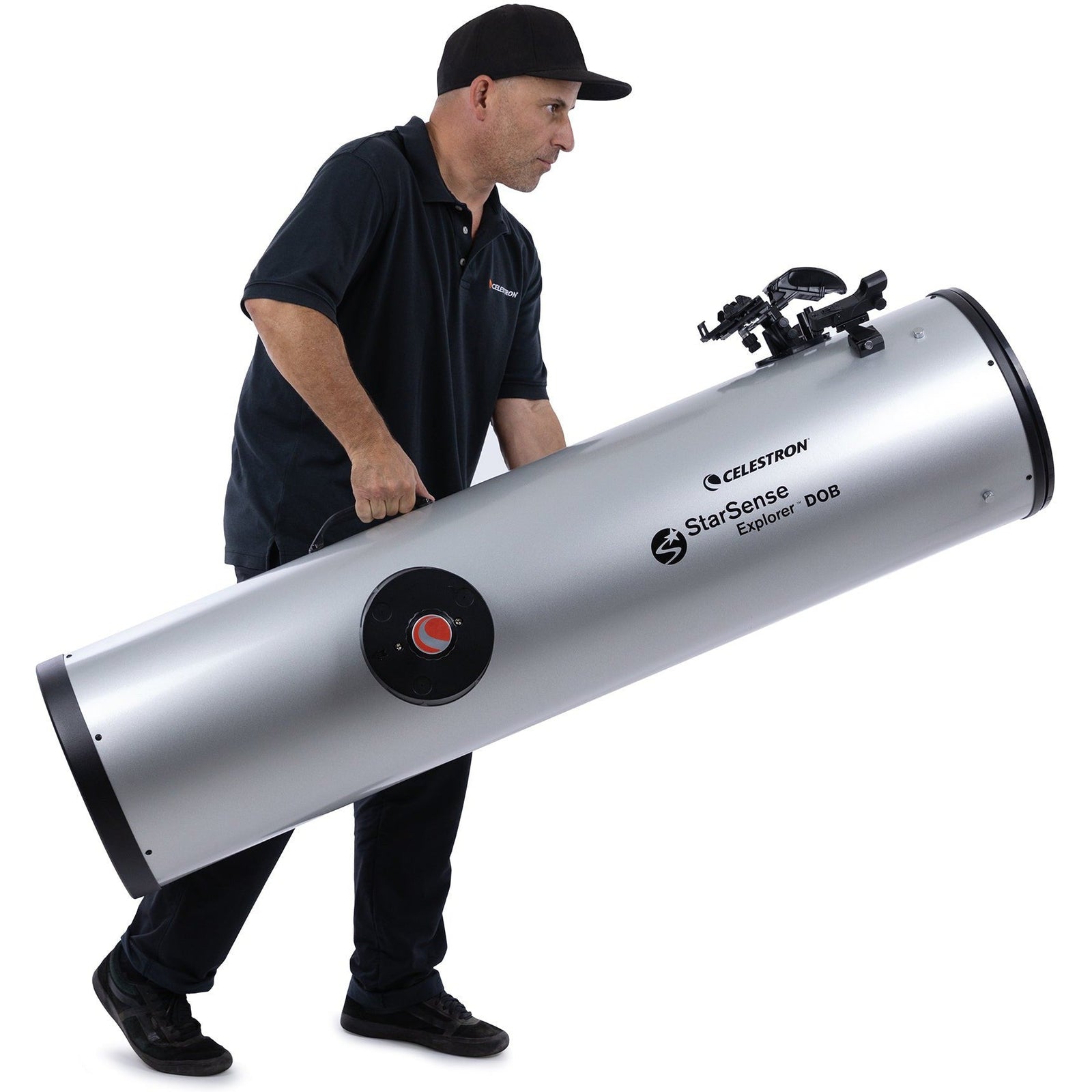 Observer carrying the full-length Celestron StarSense Explorer 12-inch Dobsonian optical tube
