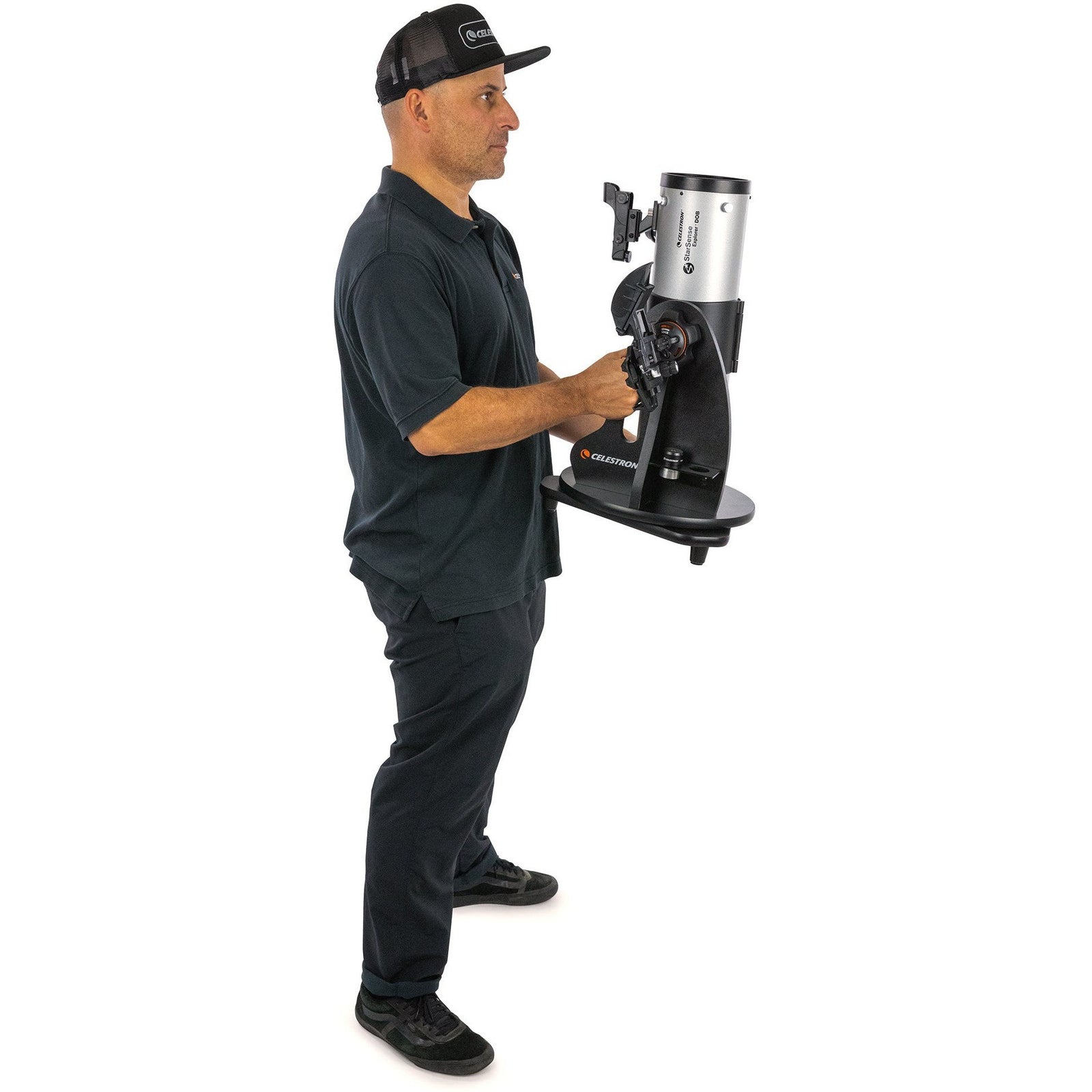 Celestron StarSense Explorer 114mm tabletop Dobsonian being carried