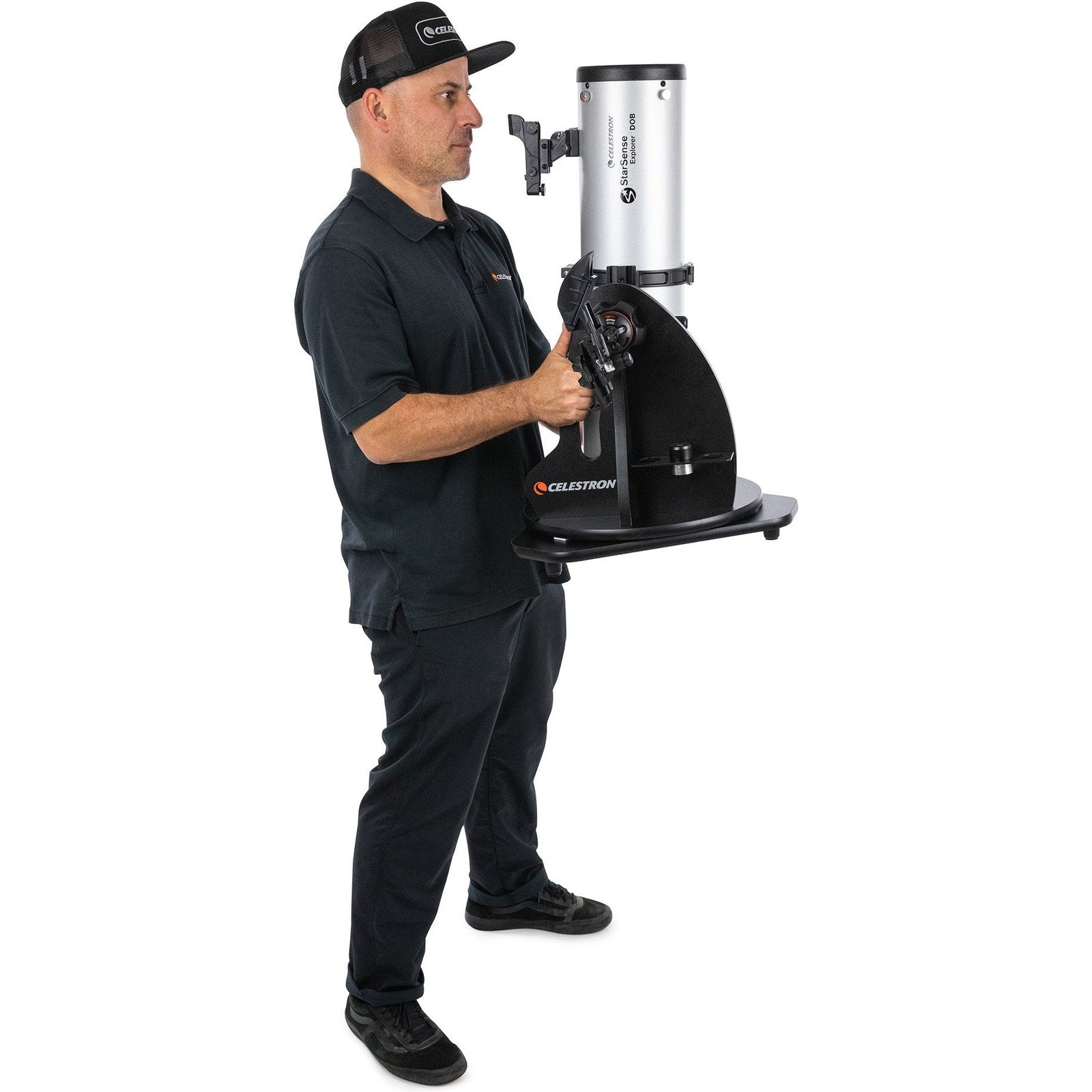 Celestron StarSense Explorer 130mm tabletop Dobsonian being carried